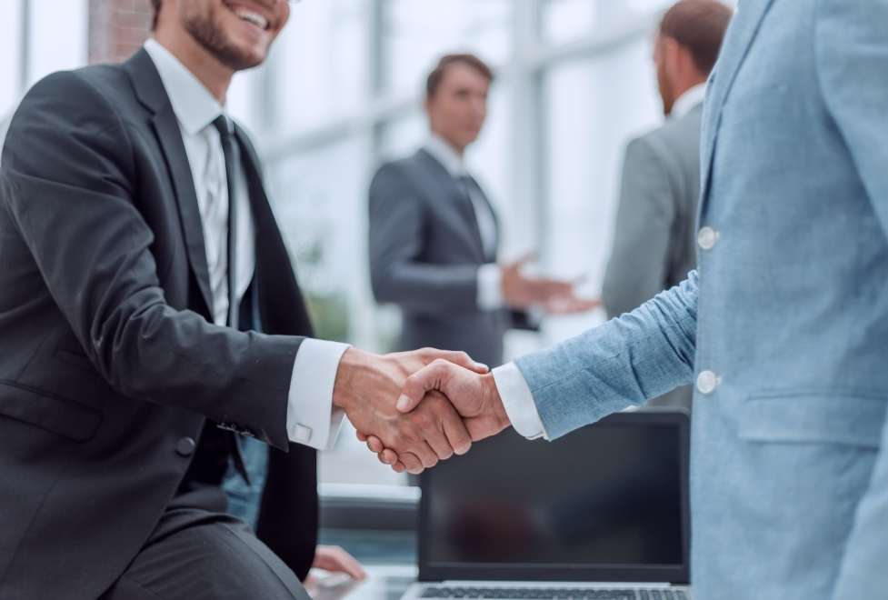 shutterstock image two people shacking hands 