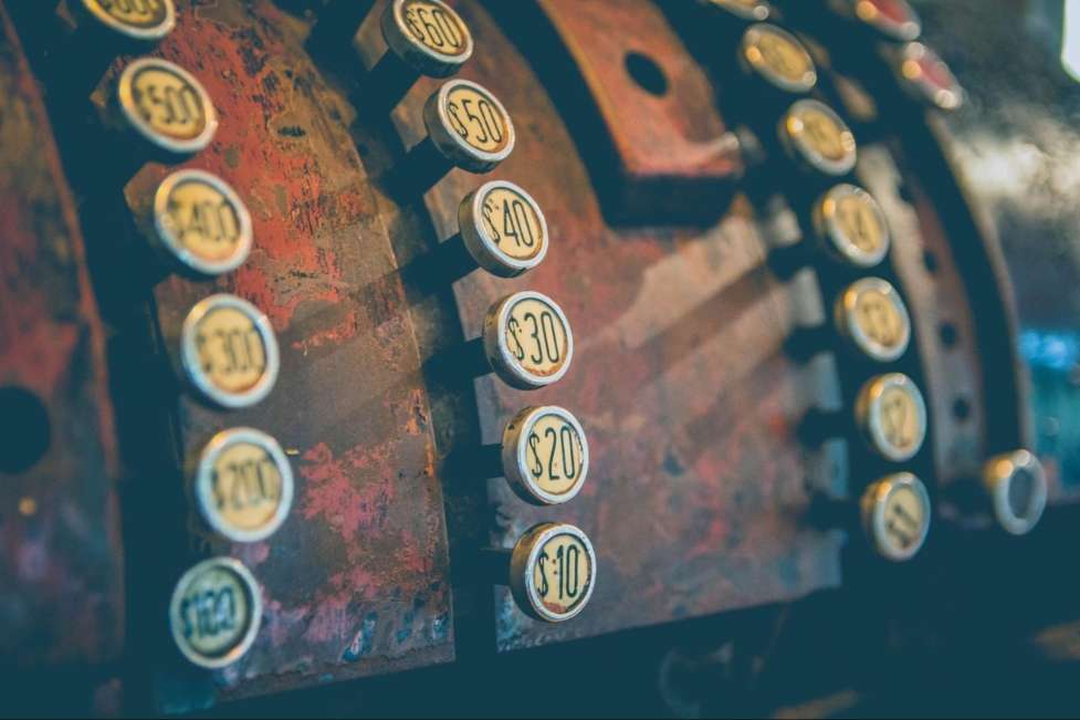 a stock photo of a old cashing machine 