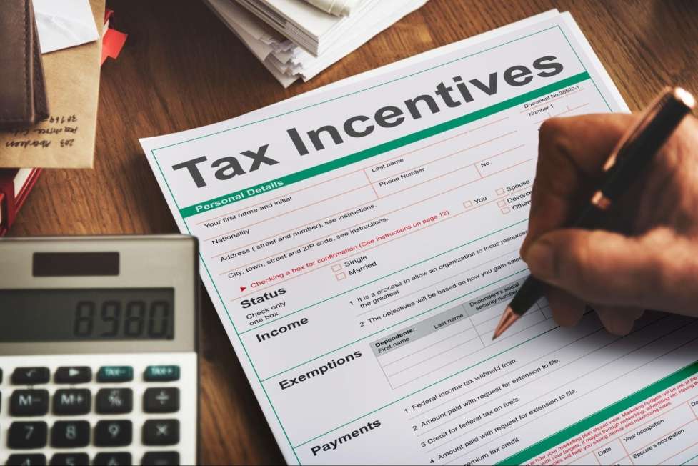 stock image of a person filling a tax document 