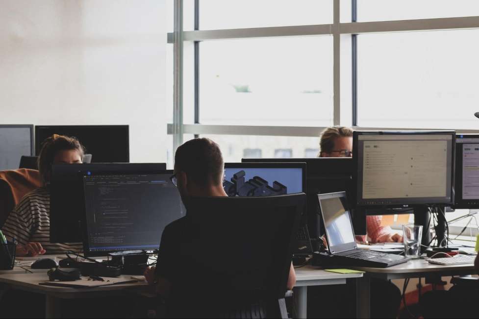 stock image of some people working on a office 