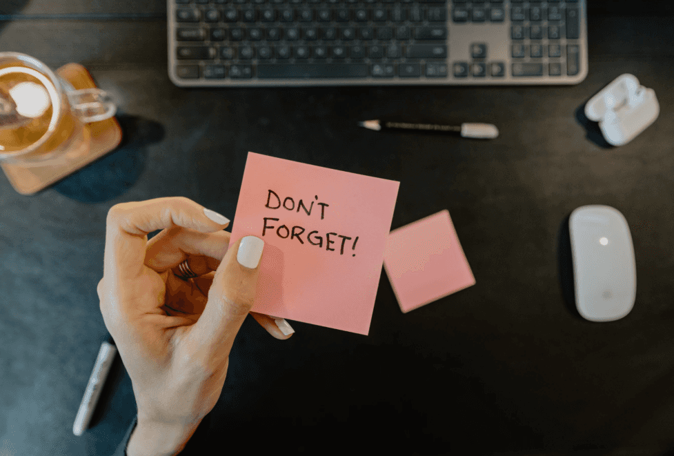 stock image of a post it with the text: dont forget 