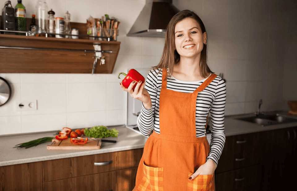 stock image of a woman in a kitchen 