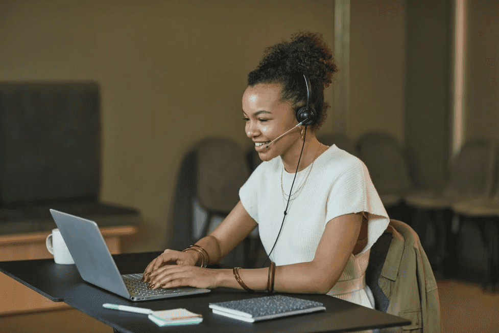 stock image of a girl sitting in front of a computer 