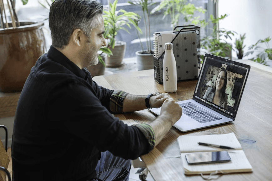 stock image of two colleagues having a virtual meeting 