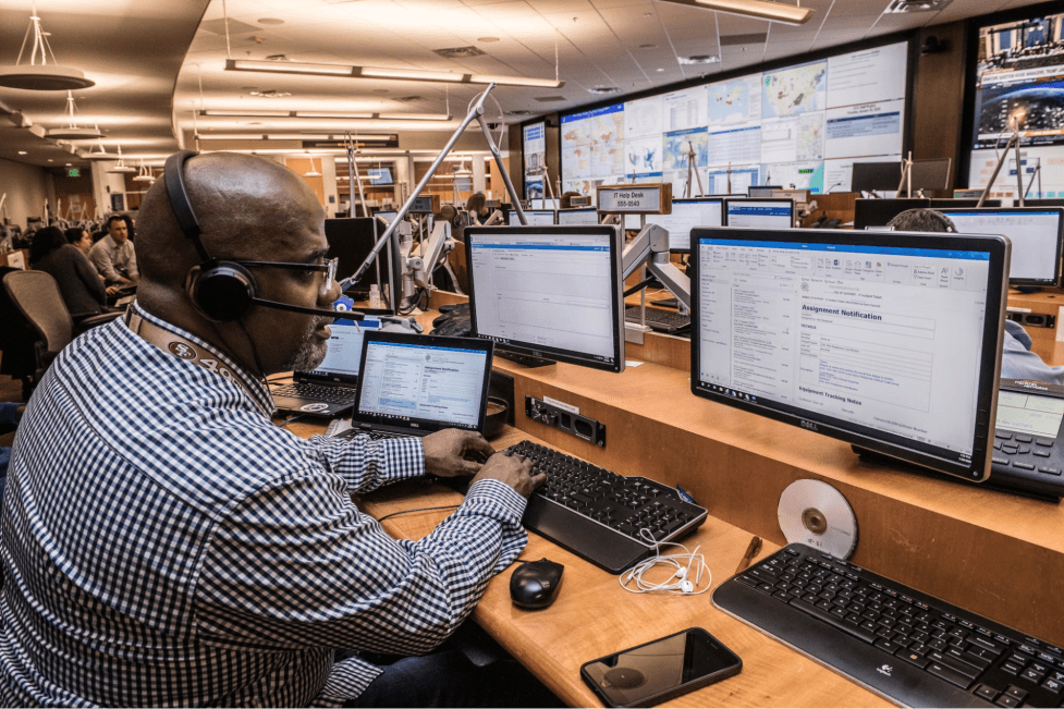 a financial trader working on his computer 