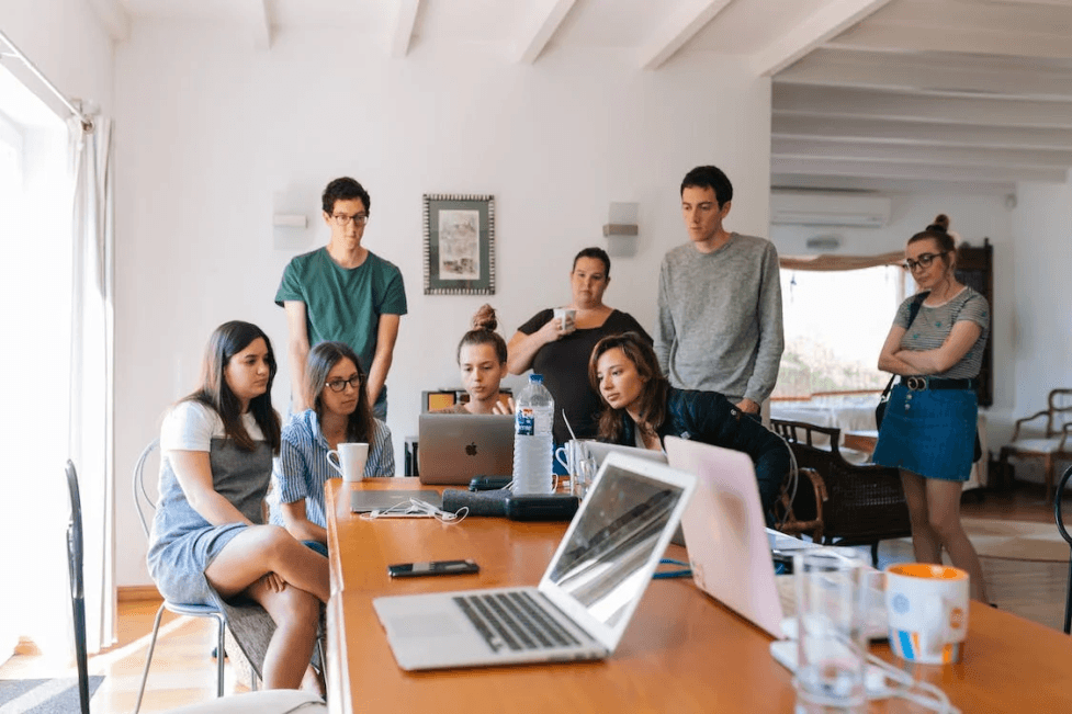 a stock image of a group of young people working together 