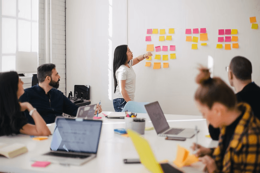 stock image of a meeting between colleagues in a office brainstorming some ideas 