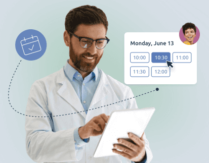 a doctor revising his online calendar and the appointments made online by patients